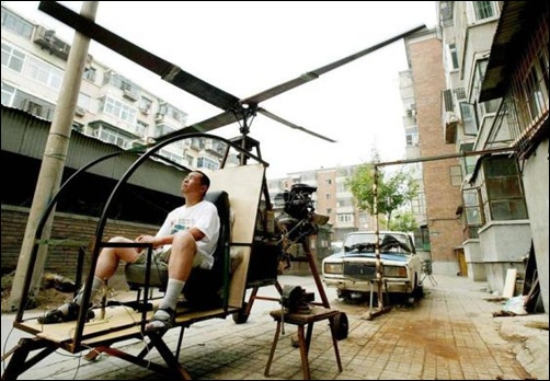 A self-styled Chinese inventor tests his homemade helicoptor next to his apartment in Beijing.