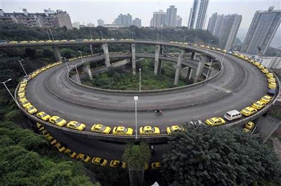Taxis line up to get their tanks filled on a ramp in Chongqing municipality.