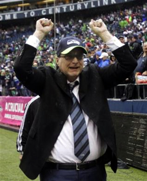 Seattle Seahawks owner Paul Allen celebrates his team's win over the New England Patriots following their NFL football game in Seattle, Washington, in this October 14, 2012 file photo.