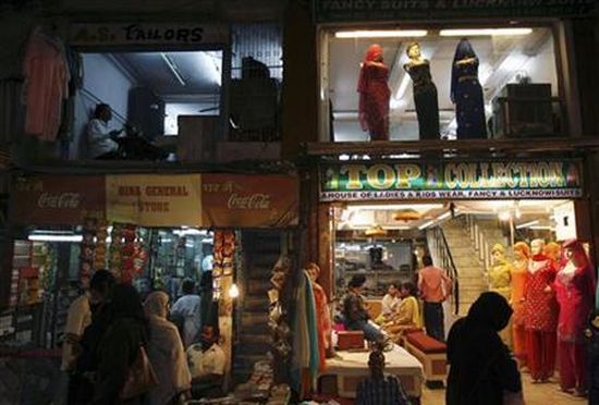 Women shop at a market place in the old quarters of Delhi.
