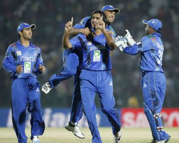 Shahpoor Zadran celebrates after picking up a wicket