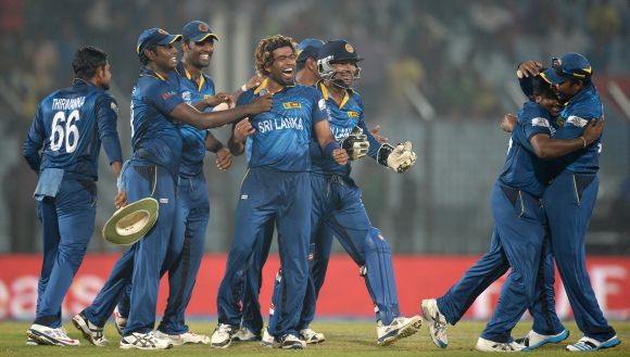 The Sri Lankan players celebrate after winning the game against New Zealand