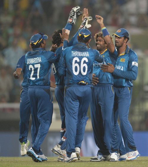 Sri Lankan players celebrate after picking a wicket