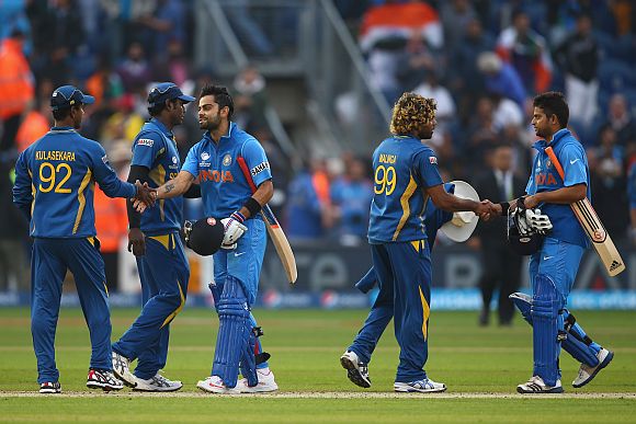 Indian players shake hands with Sri Lankan players after a match