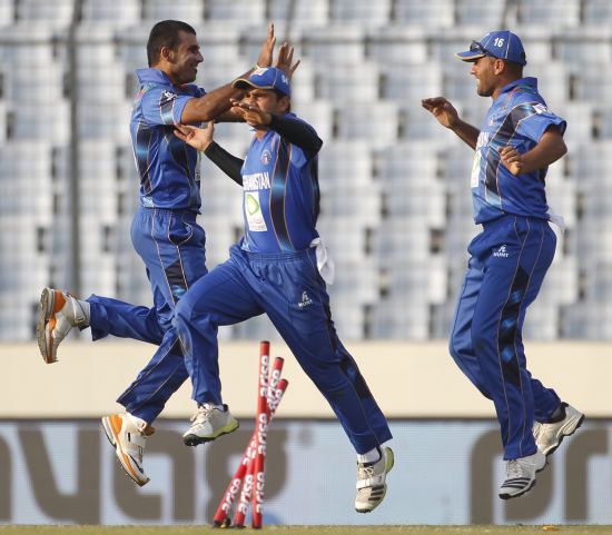 Afghanistan players celebrate after picking up a wicket
