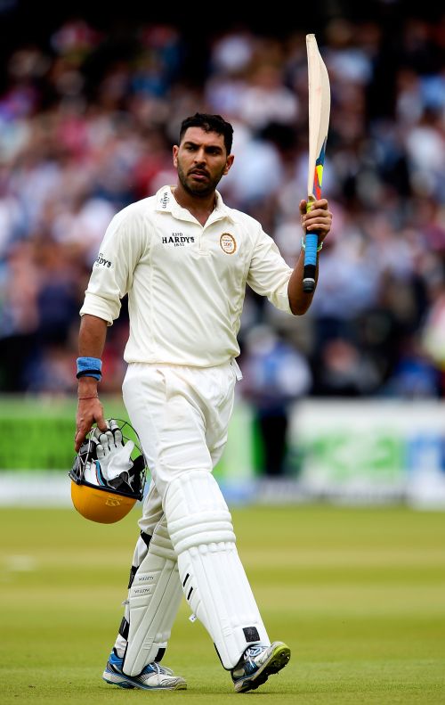 Yuvraj Singh celebrates after completing his century