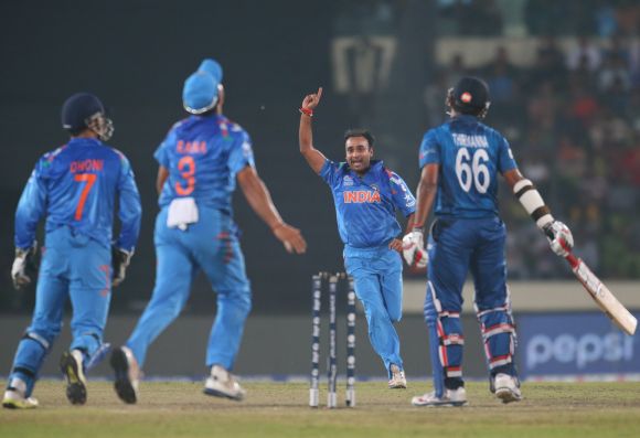 Amit Mishra celebrates after picking the wicket of Lahiru Thirimanne