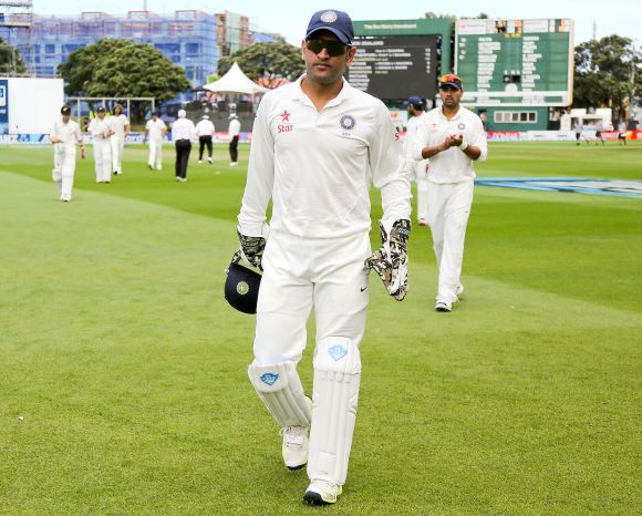 Mahendra Singh Dhoni leads the team out in a Test match