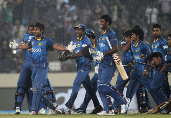 Sri Lankan players hug each other after winning the World T20
