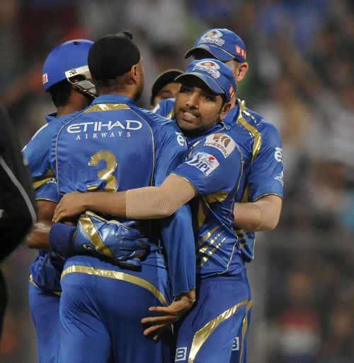 Rohit Sharma celebrates after a fall of a wicket