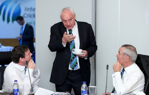 Cricket Australia chairman Wally Edwards (centre) talks with Alan Isaac (right), president of the ICC and Iain Higgins (left) ,Head of Legal at the ICC during the ICC Board Meeting
