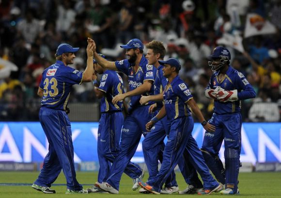 Rajasthan Royals players celebrate after picking a wicket