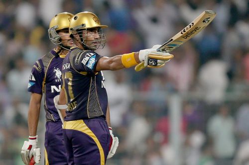 Robin Uthappa reacts after completing his half-century