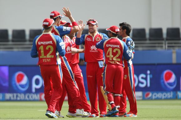 Royal Challengers Bangalore players celebrate after picking up a wicket
