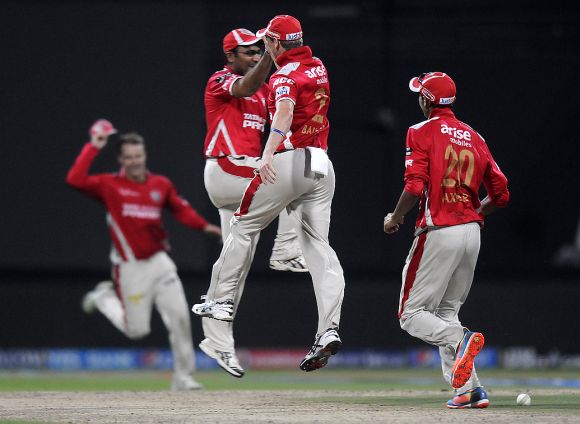 George Bailey celebrates with Virender Sehwag after a fall of a wicket