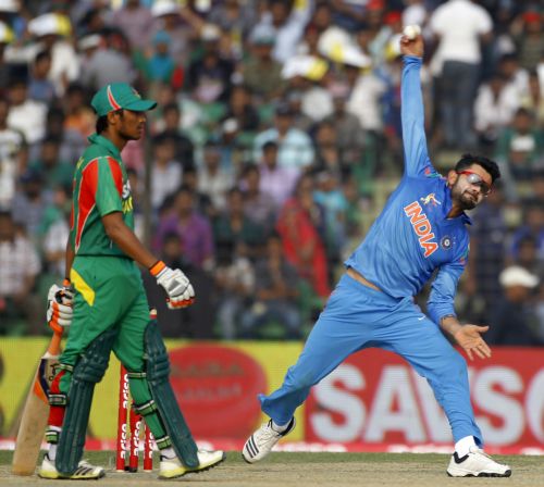 Virat Kohli bowls during the match against Bangladesh on Wednesday