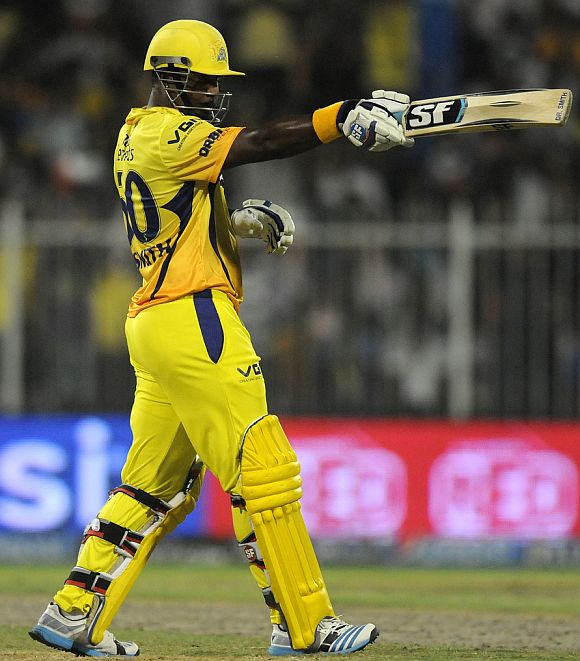 Dwayne Smith celebrates after reaching his half-century