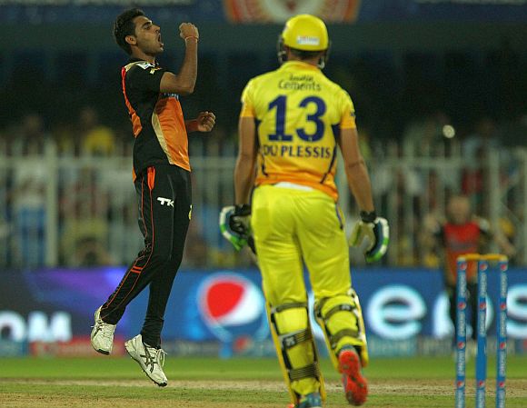 Bhuvneshwar Kumar celebrates after dismissing Faf du Plessis