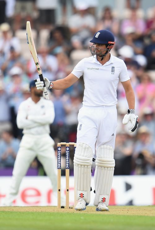 Alastair Cook of England salutes the fans as he reaches 50 not out during Day 1 of the 3rd Investec Test match between England and India 