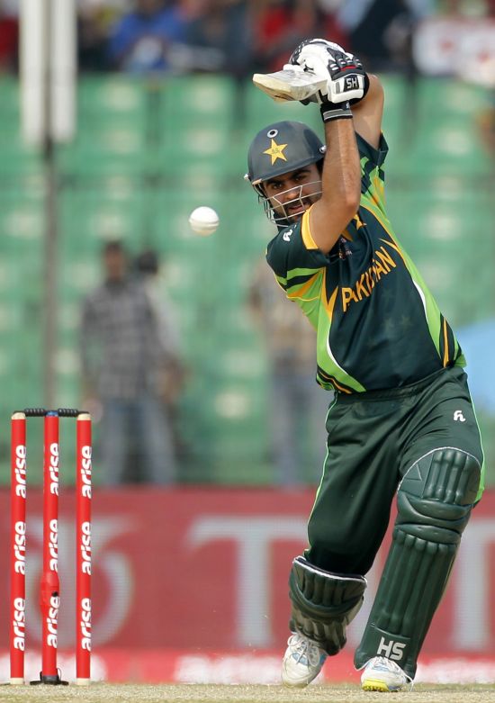 Pakistan's Ahmed Shehzad plays a ball against Afghanistan during their Asia Cup match in Fatullah
