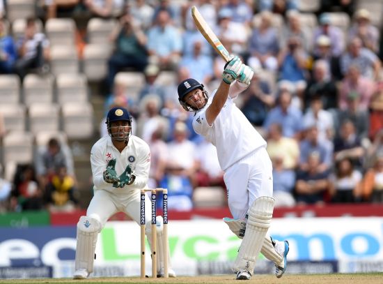 England batsman Ian Bell hits Jadeja for six runs watched by India wicketkeeper M.S. Dhoni during day two of the 3rd Investec Test