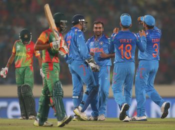 Amit Mishra is congratulated by teammates after picking a wicket
