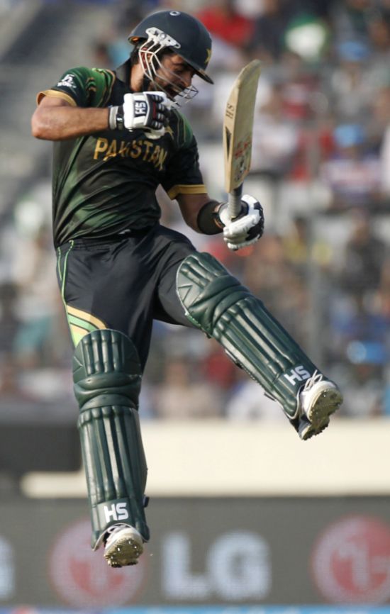 Ahmed Shehzad celebrates after picking up a wicket