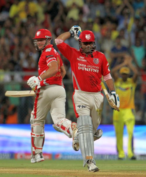 Virender Sehwag rejoices after completing his century.