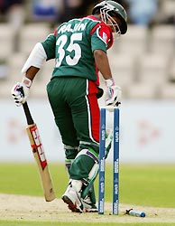 Bangladesh captain Rajin Saleh is bowled by Mervyn Dillon