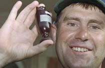 Mark Taylor holds up the Ashes urn