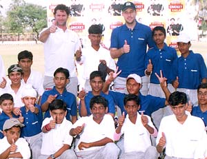 Cairns and Vettori with the kids