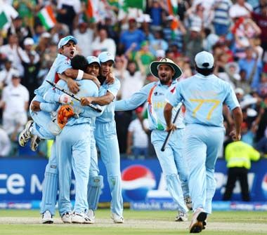The Indian team celebrates the fall of the final wicket. It was India's first major triumph since winning the 60 overs-a-side World Cup in 1983