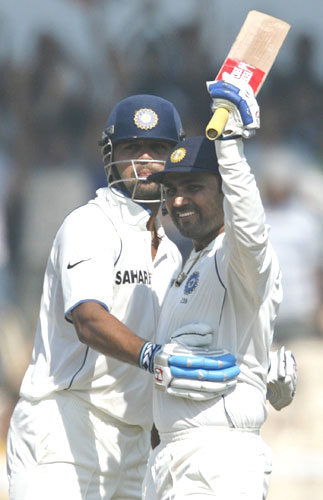 Sehwag celebrates with M Vijay after completing his ton