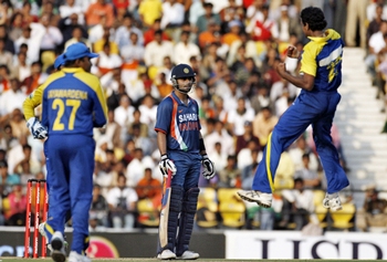 Virat Kohli watches helplessly as the Lankans celebrate