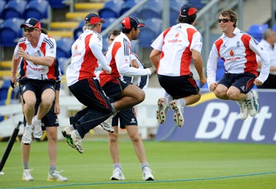 England's Paul Collingwood (left) and Graeme Swann (right) join teammates as they take part in skipping during a training session