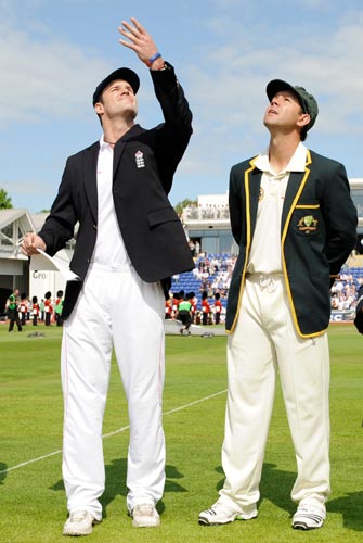 England's captain Andrew Strauss (left) tosses the coin watched by Australia's Ricky Ponting before the first Ashes Test in Cardiff
