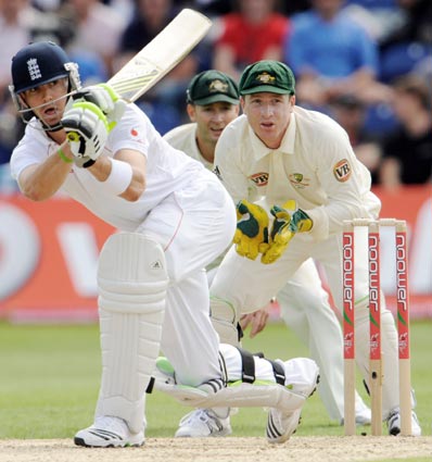 England's Kevin Pietersen (left) hits out watched by Australia's Brad Haddin (right) and Michael Clarke during the first Ashes Test in Cardiff