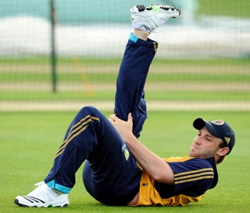 Australia's Phillip Hughes stretches during training