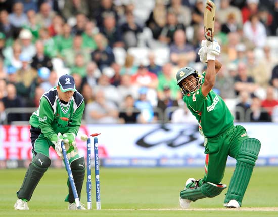 Raqibul Hasan is bowled by Kyle McCallan (not in picture) as wicketkeeper Niall O'Brien looks on