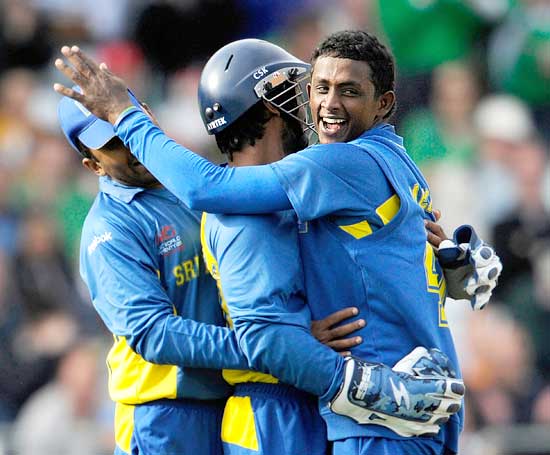 Ajantha Mendis (right) is congratulated after the spinner dismissed Shane Watson