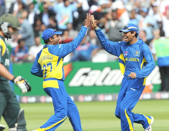 Tillakaratne Dilshan celebrates after taking a catch to dismiss Shahid Afridi