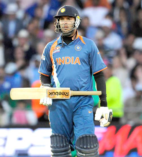 Yuvraj Singh waits for the decision before he was given out caught