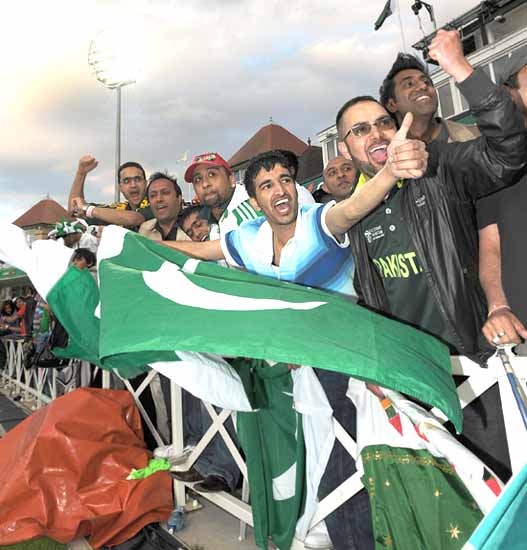 Pakistani fans celebrate their team's victory over South Africa