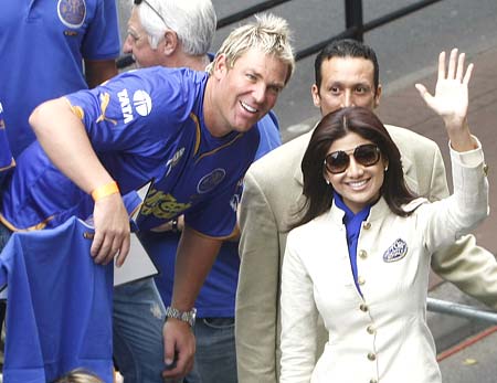 Rajasthan Royals skipper Shane Warne and franchisee part-owner Shipla Shetty wave to crowd during a street parade in Cape Town