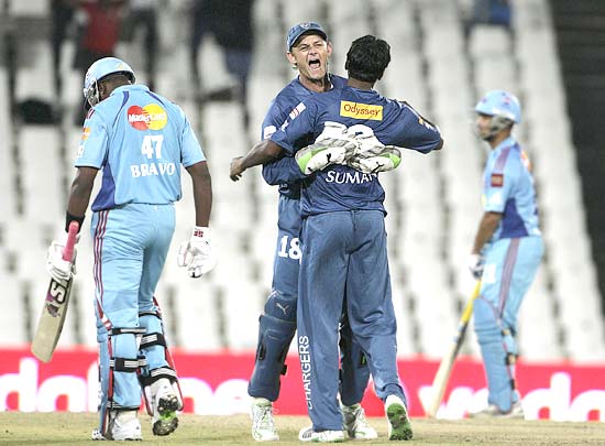 Deccan Chargers captain Adam Gilchrist celebrates with Tirumalsetti Suman after the dismissal of Bravo