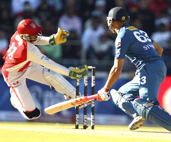 Wicketkeeper Kumar Sangakkara whips off the bails in a flash to stump Andrew Symonds for 25