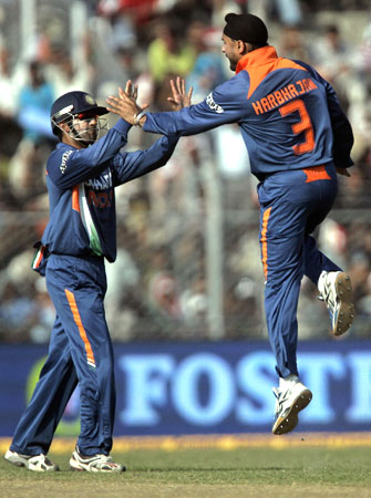 Harbhajan Singh and Gautam Gambhir celebrate the wicket of Ricky Ponting
