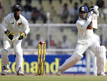 Sachin Tendulkar (right) plays a shot as Sri Lanka's wicketkeeper Prasanna Jayawardene looks on
