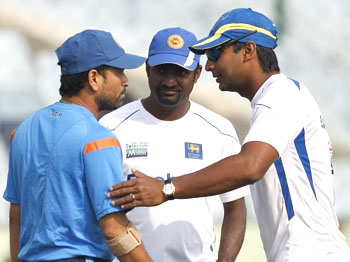 Sachin Tendulkar chats with Sri Lankan captain Kumar Sangakkara and Muttiah Muralitharan on Monday