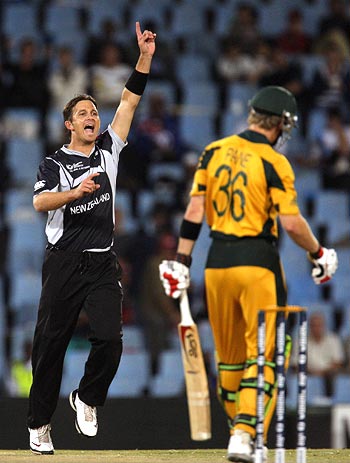 Shane Bond celebrates after taking the wicket of Tim Paine